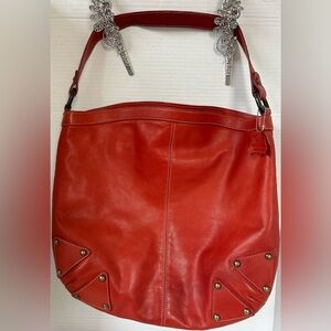 GOJI BRICK RED GENUINE LEATHER HOBO BAG. BRASS HARDWARE, RED ZIP.